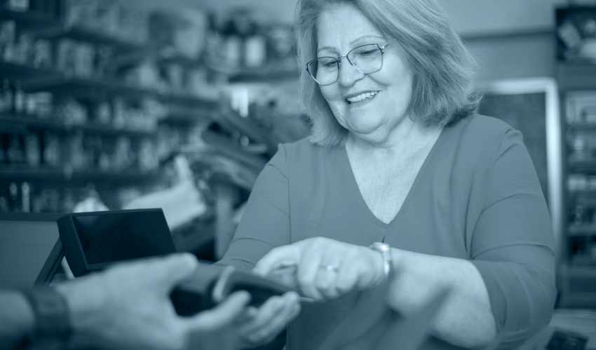 woman paying the cashier at a store